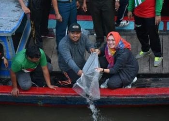 Walikota Tanjungbalai Lepas 20 Ribu Ikan Nila dan 6 Ribu Gurame