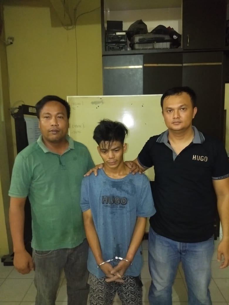 (Ignatius siagian/taslabnews) Tersangka Muhammad Ikhsan Manurung saat diamankan di Polres Tanjungbalai.