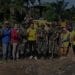 Pihak DLH Labuhanbatu, Camat Rantau Utara Turing Ritonga, bersama anggota TNI berfoto seusai kegiatan.