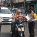 Sambut Hari Bhayangkara ke-74, Polsek Kisaran Kota Bagikan Masker ke Warga