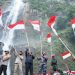 Bupati Asahan Bersama Forkopimda Kibarkan 75 Bendera Merah Putih di Air Terjun Siponot