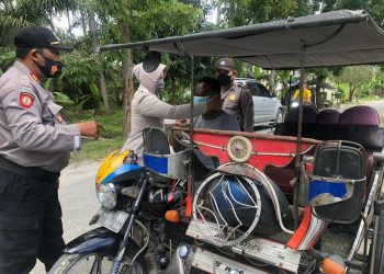Lagi, Sat Binmas Polres Tanjungbalai Bagi Masker dan Imbau Warga Patuhi Protokol Kesehatan