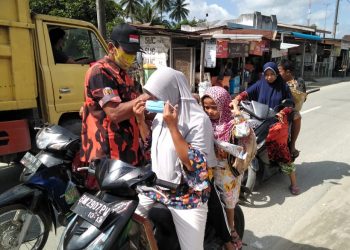 HUT ke 61 Pemuda Pancasila, PAC Kecamatan Meranti Bagi-bagi Masker