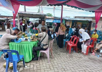 Polres Asahan Lakukan Vaksinasi Massal dan Salurkan Sembako untuk Warga