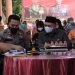 Bupati Labuhanbatu H Erik Adtrada Ritonga saat bersama Wakapolres Labuhanbatu Hermansyah.