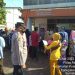 Personel Polsek Pulau Raja Asahan Amankan Penyaluran Dana BPNT di Kantor Pos