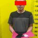 Tersangka saat di kantor polisi