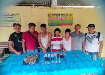 Ketiga tersangka saat di kantor polisi