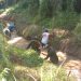 Babinsa Bersama Warga Gotong Royong Bersihkan Drainase