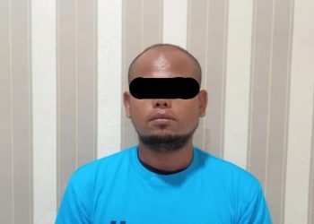 Tersangka saat berada di kantor Polisi.