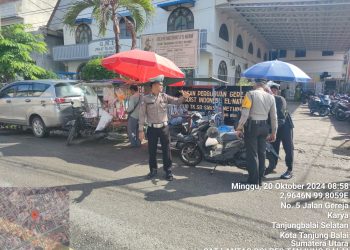 Personel Sat Lantas Polres Tanjungbalai Urai Arus Lalulintas Saat Ibadah Minggu