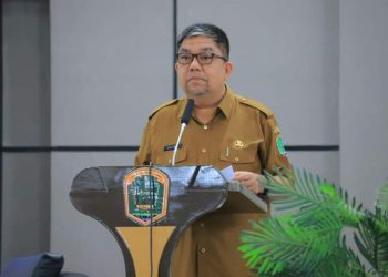 Asisten II Bidang Perekonomian dan Pembangunan Pemkab Labura, H. Muhmmad Ikhwan Lubis, membacakan sambutan tertulis Pjs. Bupati Labura
