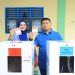 Bupati Labura, Dr. Hendriyanto Sitorus, dan istri memberikan hak suaranya di TPS 002 Aek Kanopan Timur