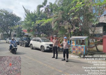 Personel Sat Lantas Polres Tanjungbalai Gelar Pam Saat Ibadah Minggu