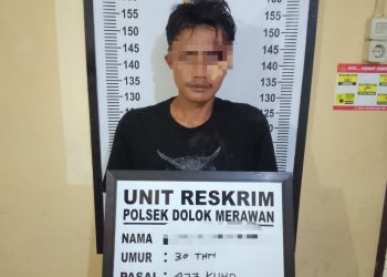 Tersangka pelaku curanmor saat di kantor polisi.