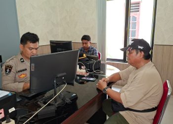 Korban saat membuat laporan ke polisi
