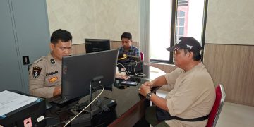 Korban saat membuat laporan ke polisi