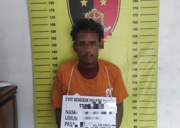 Tersangka Ginot saat diamankan polisi. 