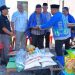 Kepala Dinas Sosial Labuhanbatu Syahrizal dan pihak Baznas Labuhanbatu saat berkunjung ke rumah korban kebakaran di desa Tanjung Medan. 