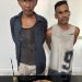 Kedua Tersangka saat di kantor polisi.