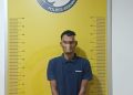 Tersangka saat di kantor polisi.